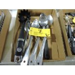 Slotted, solid mixing spoons.