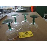 Green stemmed bar glasses.