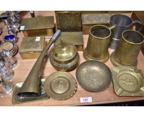 A collection of brassware, including tea caddy, ashtrays, tankards, a lidded bowl etc.