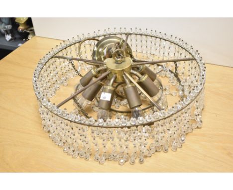 A vintage eight bulb glass light fitting having beaded droplets.