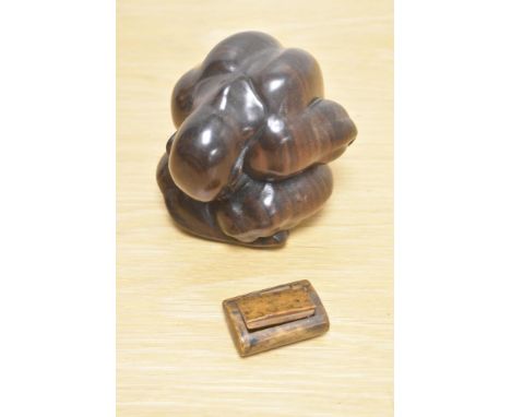 A carved hardwood weeping Buddha and an antique treen snuff box.