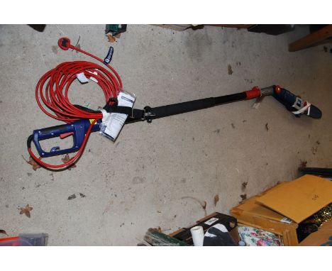 A Spear & Jackson 240v long arm strimmer with chainsaw head.