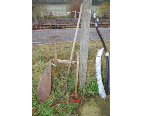 A hay knife, a beet fork, a log splitter and a hedge bill.