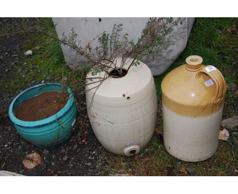 A large glazed flagon, a glazed planter and another planter (with shrub).