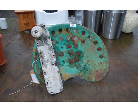 An implement seat and an aluminium engine side panel with side cap.