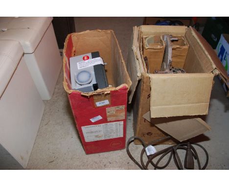 A Leitz projector and a Bell & Howell projector.