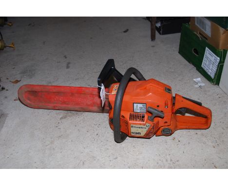 A Husqvarna 136 chainsaw with 3" cutter bar.
