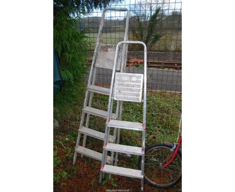 A four rung step ladder and a five rung step ladder.