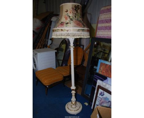 A cream painted Standard lamp with reeded support terminating in acanthus leaf decoration to base, with floral shade.