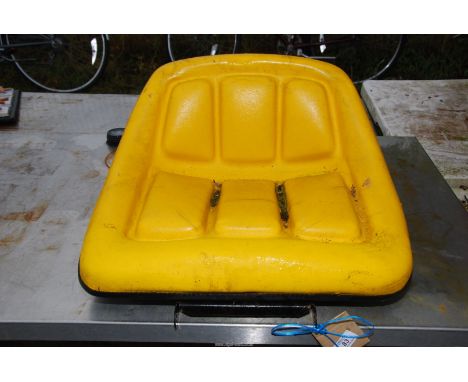Yellow tractor seat.