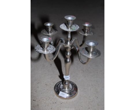 A plated candelabra.