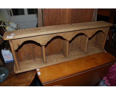 A scrubbed pine wall shelf unit, 42 1/2" wide x 7" depth x 13 1/2" high.