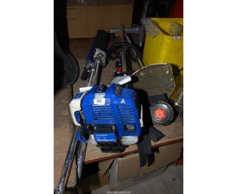 A "Hyundia" bump feed Strimmer, a chainsaw/hedge trimmer combination (the on/off switch not working) good compression.