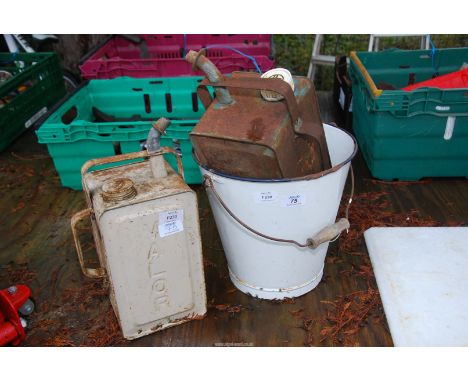 Two fuel containers and enamel bucket.