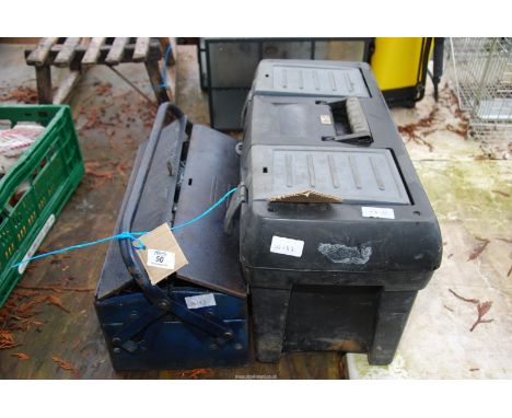 A cantilever tool box containing sockets, hand tools, etc. and various other tools.
