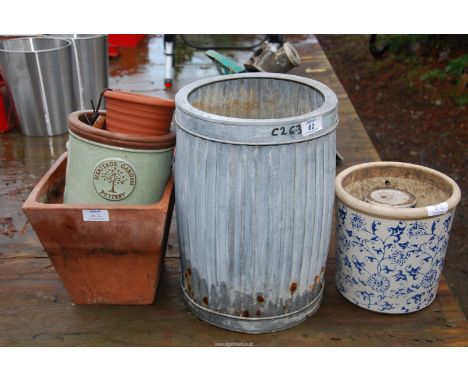 A galvanised planter, plus terracotta and glazed planters.