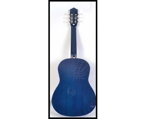 A 20th century Stagg acoustic six string Spanish style guitar finished in blue with carry bag.