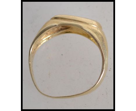 A 14ct gold signet ring set with a single clear stone. Marked 585, tests 14ct gold. Size R. Weight 5.8g.