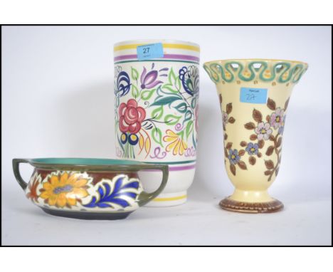 Ceramics to include a vintage Poole Pottery vase of large form along with two Gouda floral pieces, all marked to base. Talles