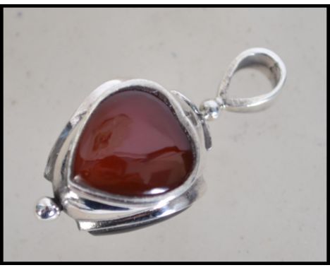 A decorative ladies silver fob in the form of a heart set with agate opal and amber inset stones with bale atop. Weight 9g. M