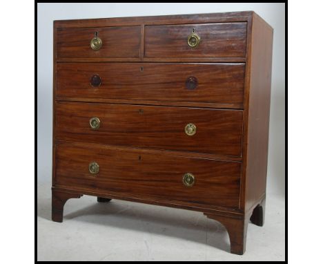 A Georgian 19th century mahogany inlaid chest of drawers being raised on bracket feet with 2 short over 3 deep drawer configu
