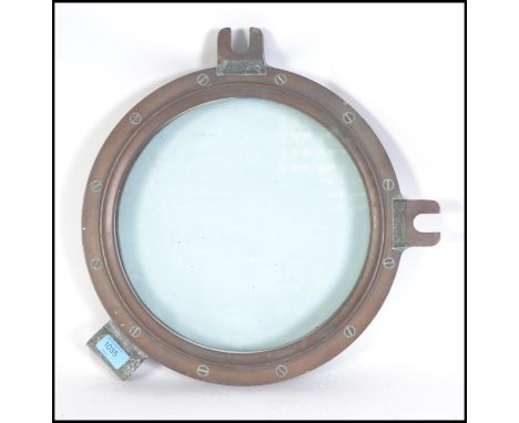 Shipping interest A vintage 20th century industrial brass heavy ships porthole measuring 37cm diameter.