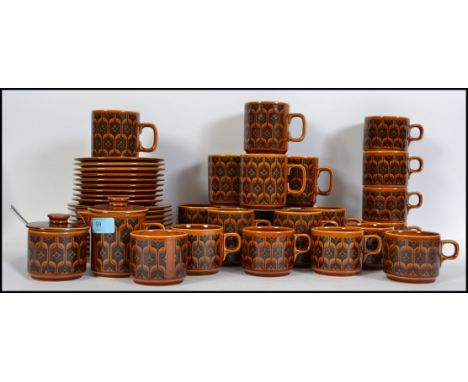 A 1960's Hornsea ' Heirloom ' pattern ceramic tea / coffee service comprising cups, saucers, plates, milk jug with lid, sugar