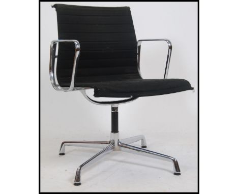 A 20th century retro style Eames chrome and black fabric r upholstered shaped office swivel chair with elbow rests. Measures 