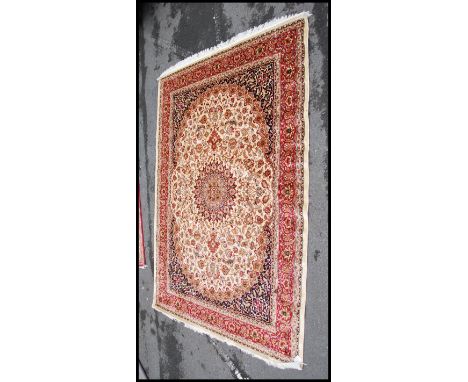 A large Iranian / Persian Keshan carpet - rug having beige ground with geometric decoration and borders. Measures 2.8m x 2.0m