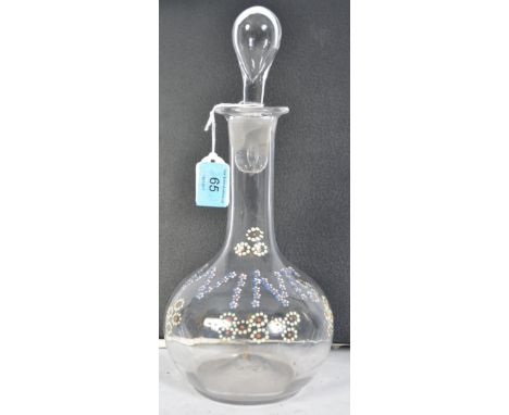 A 19th century enamel decorated blown glass decanter. The bulbous body with enamelled notation ' wine ' Complete with stopper