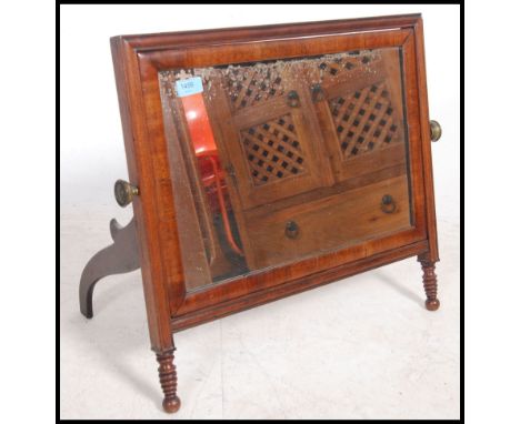 A Regency mahogany easel back dressing mirror having a square framed mirror supported on easel back with bobbin supports. Mea