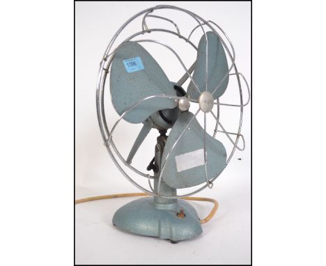 A mid 20th century vintage industrial electronic desk fan by H Frost &amp; Co of Walsall, finished with a light blue enamel b