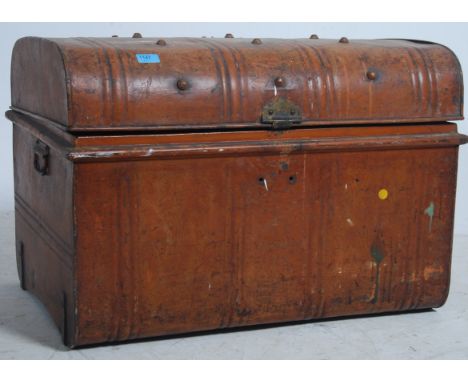 A late 19th century Victorian tin travelling trunk with original wood grained finish, brass lock plate and clasp.