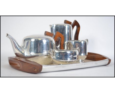 A retro 20th century Piquot Ware five piece tea and coffee service consisting of teapot, coffee pot, creamer, sugar bowl and 