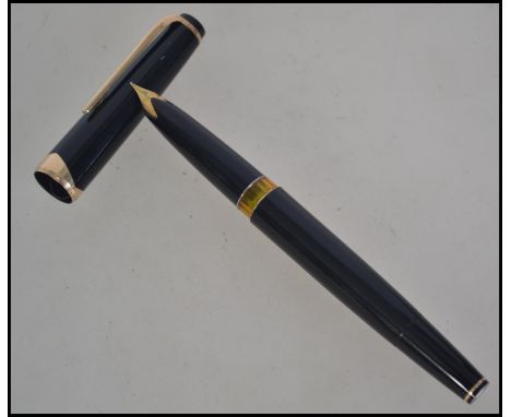 A vintage 20th century Montblanc Meisterstuck fountain pen No.14 having black resin body and gold plated trim with pull off l