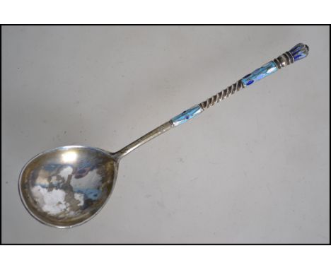 A believed Russian silver ( tested ) and enamel spoon. The spoon bowl verso decorated with enamels along with the twist stem.
