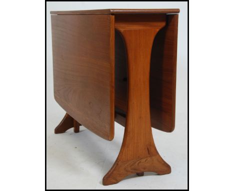 A retro 20th century G-Plan teak drop leaf dining table having splayed foot frame, the end leaves rising on gate legs. Measur