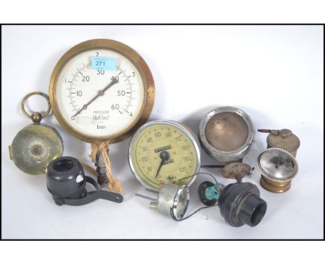 A collection of industrial and motoring relating dials and gauges to include pressure gauge, speedometer, temp gauge, car lig