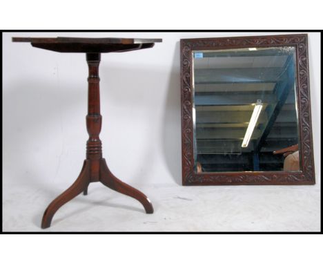 A 19th century country oak tilt top wine table being raised on tripod base having an oak planked top together with a 19th cen