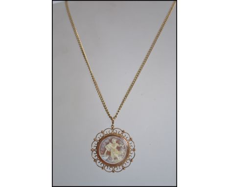 A 9ct gold hallmarked ( Birmingham / maker AJ) cameo pendant with fret worked surround set to a 9ct gold flat belcher linked 