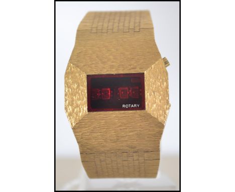 A 20th century retro 1970's yellow metal bark effect face and strap bracelet Rotary gentleman's wristwatch having digital red
