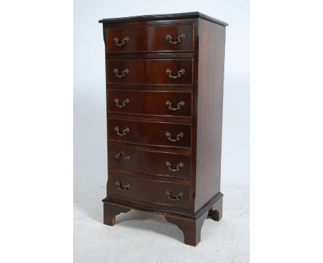 A Georgian style mahogany  bow front pedestal chest of drawers having a run of six straight drawers raised on bracket feet.