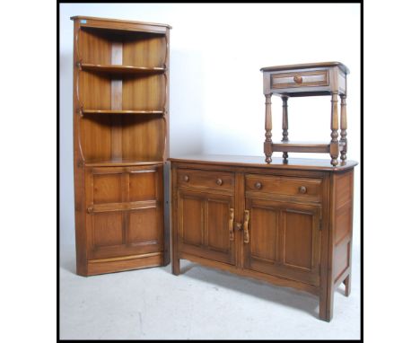 A collection of late 20th century Ercol Golden Dawn beech and elm furniture to include a sideboard, corner unit and occasiona