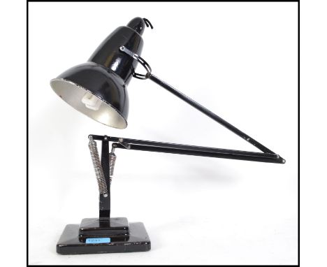 An early Herbert Terry angle poise lamp in black with a two step square base. &nbsp;This particular lamp has the much sought 