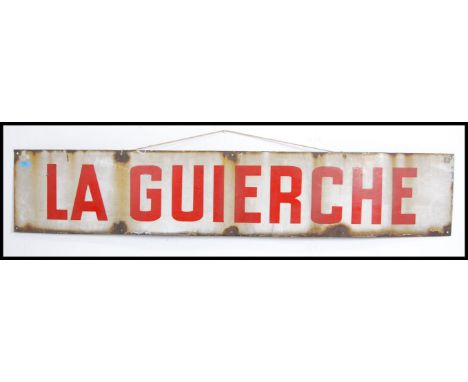 A large vintage 20th century French enamel advertising sign for La Guierche having red lettering on white ground. Measures 30