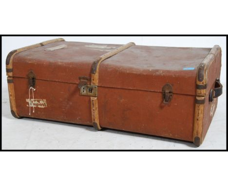 An early 20th century canvas &nbsp;cane banded steamer trunk locks &nbsp;and clasps to the front