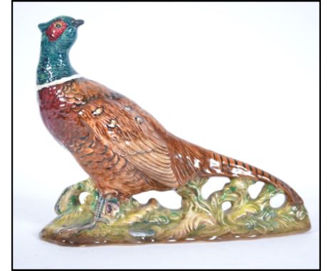 A mid 20th century Beswick ceramic figure of a male cock Pheasant. Having Beswick impressed mark to the base and number 1226.