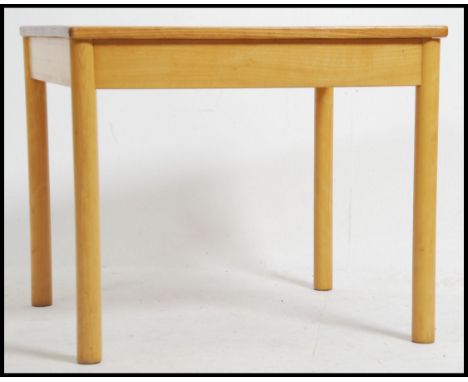A &nbsp;vintage retro Ercol blond wood coffee / occasional table. Raised on turned legs with low square table tops ( please s