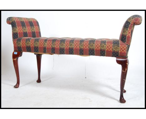 A 20th century Queen Anne revival upholstered window seat / duet plano stool being raised on cabriole legs with pad feet and 