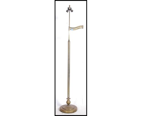 An early 20th cenutry neo-classical standard brass lamp with Corinthian column and circular base. &nbsp;Two down light lamp f